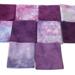 Hand dyed quilting cotton in shades of purple and pink